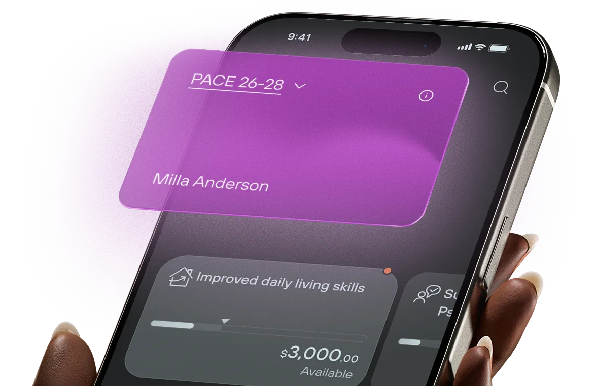 A hand holding a phone showing the Kismet plan management app